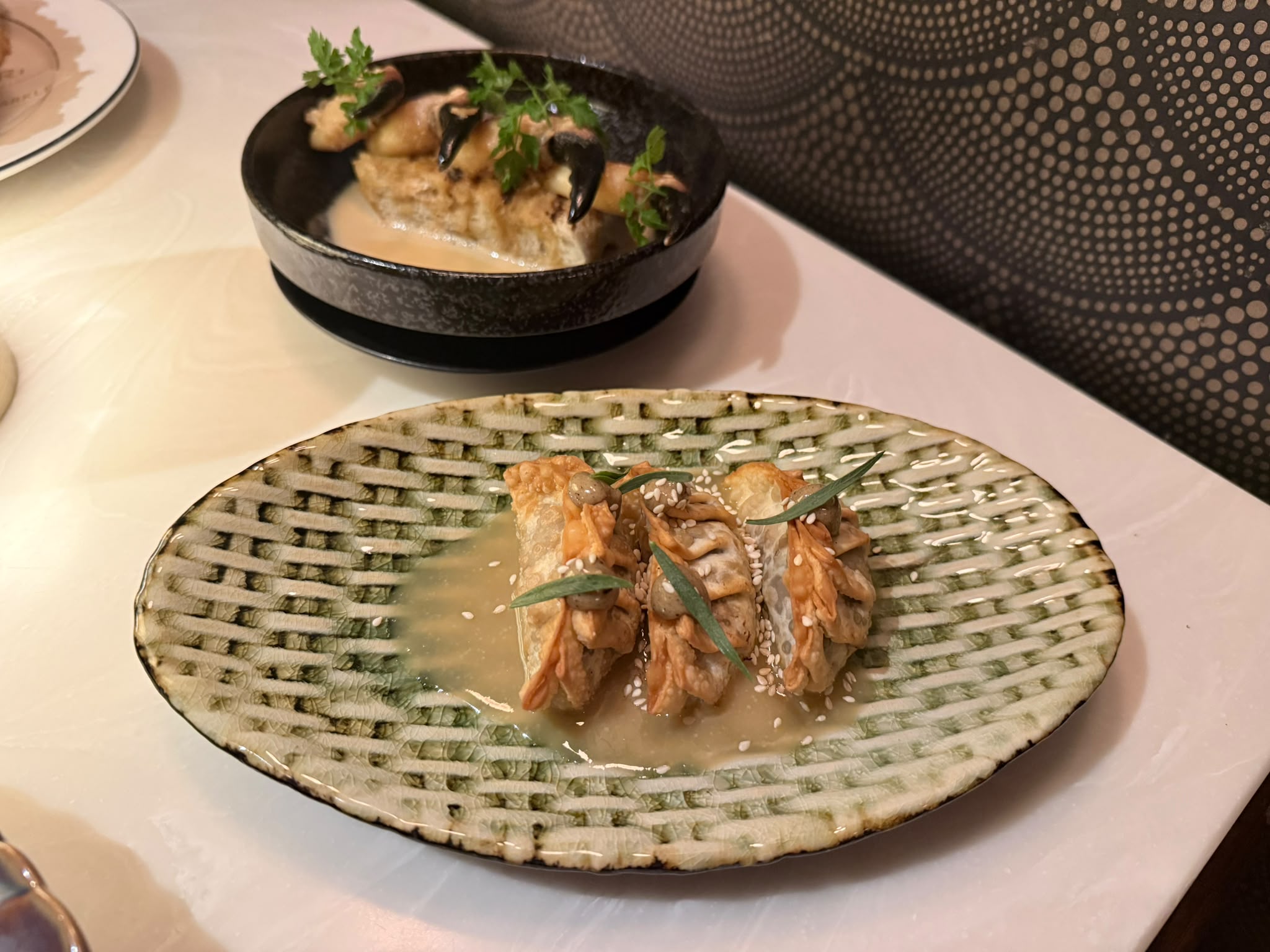 Filled parcels on a green woven-texture oval plate