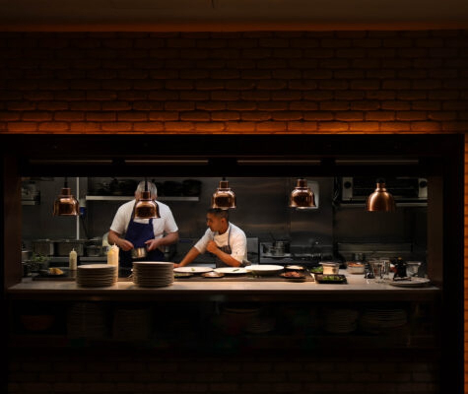 Chefs plating at the pass in the Glenroyal Hotel kitchen