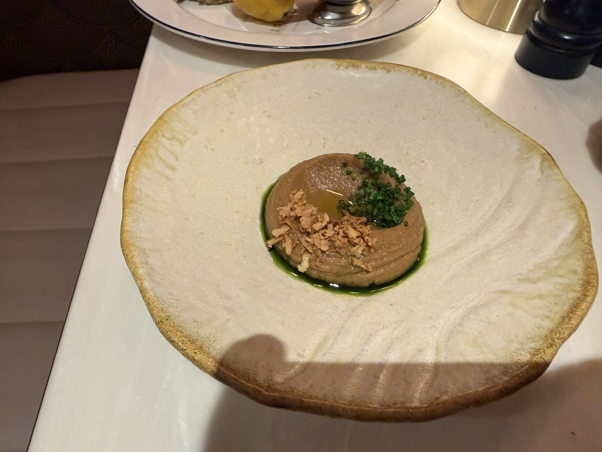 Pâté with chives and crispy onion in a cream reactive-glaze bowl