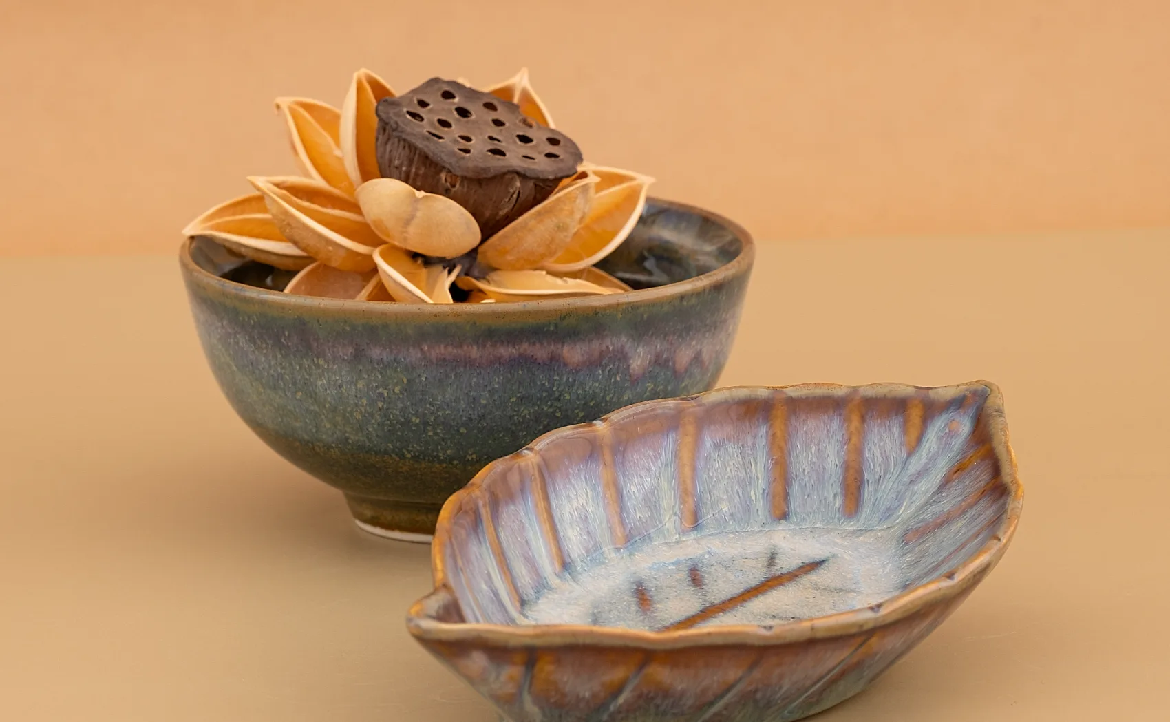 Azure Typhoon bowl and leaf-form dish, blue and mauve reactive glaze with a caramel rim