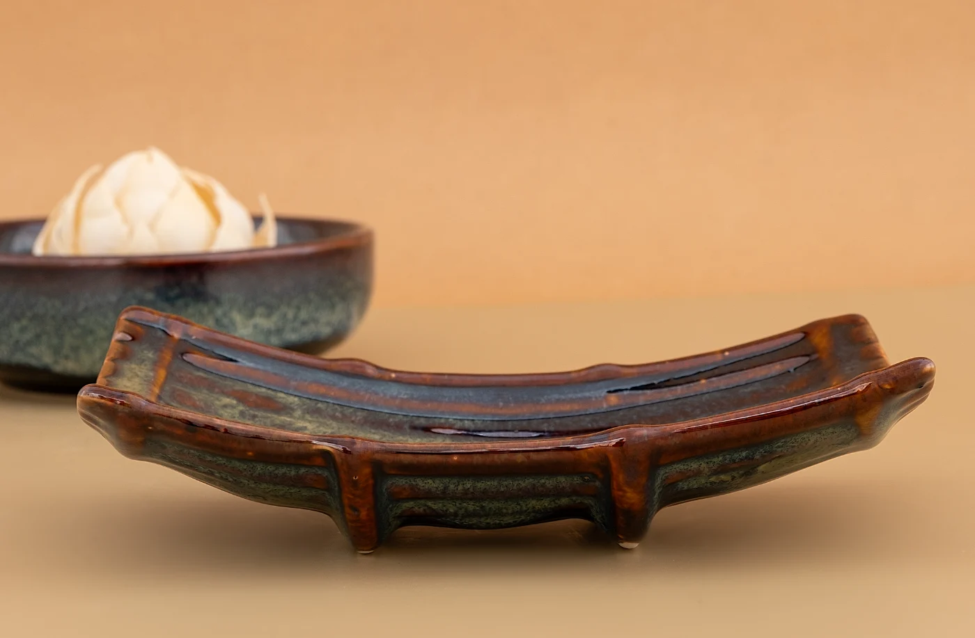 An Emerald Essence footed bridge tray and low bowl in sage and russet glaze
