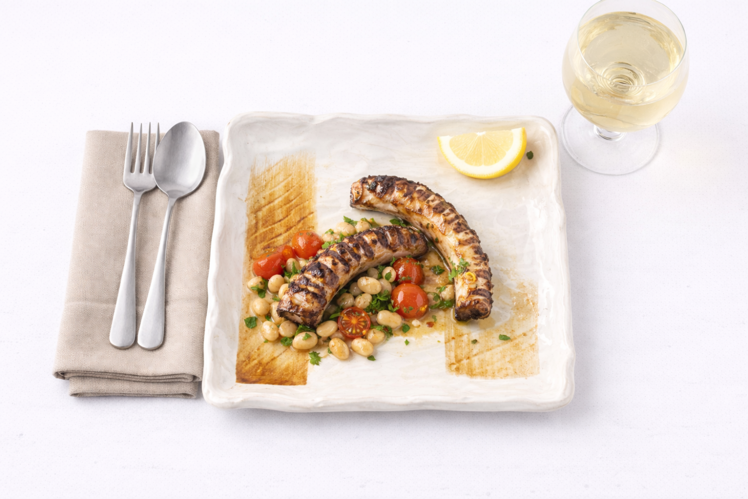 Grilled octopus with cannellini beans and tomatoes on a Golden Grove square plate