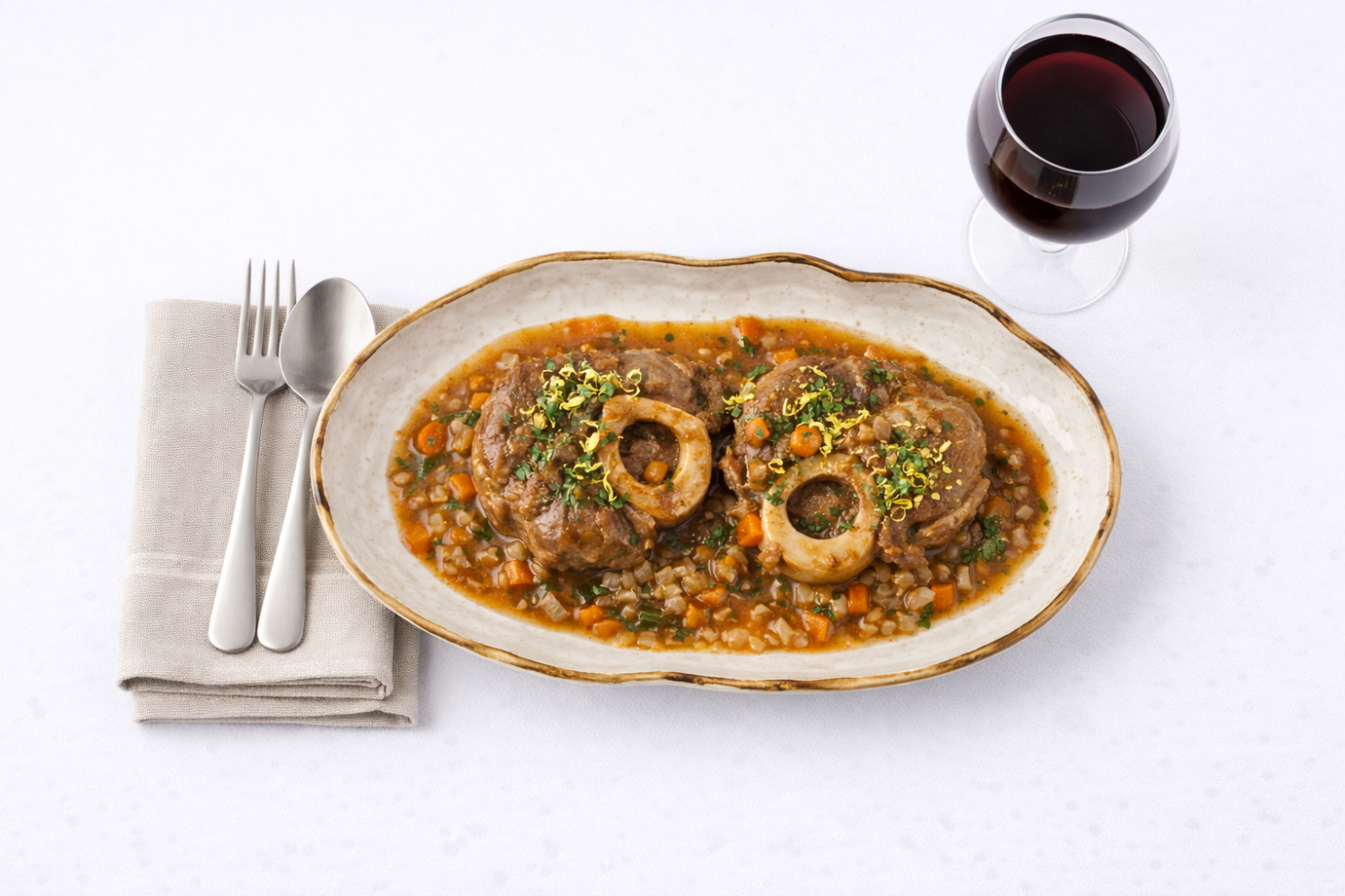 Braised osso buco with gremolata and risotto on a Golden Sands oval tray