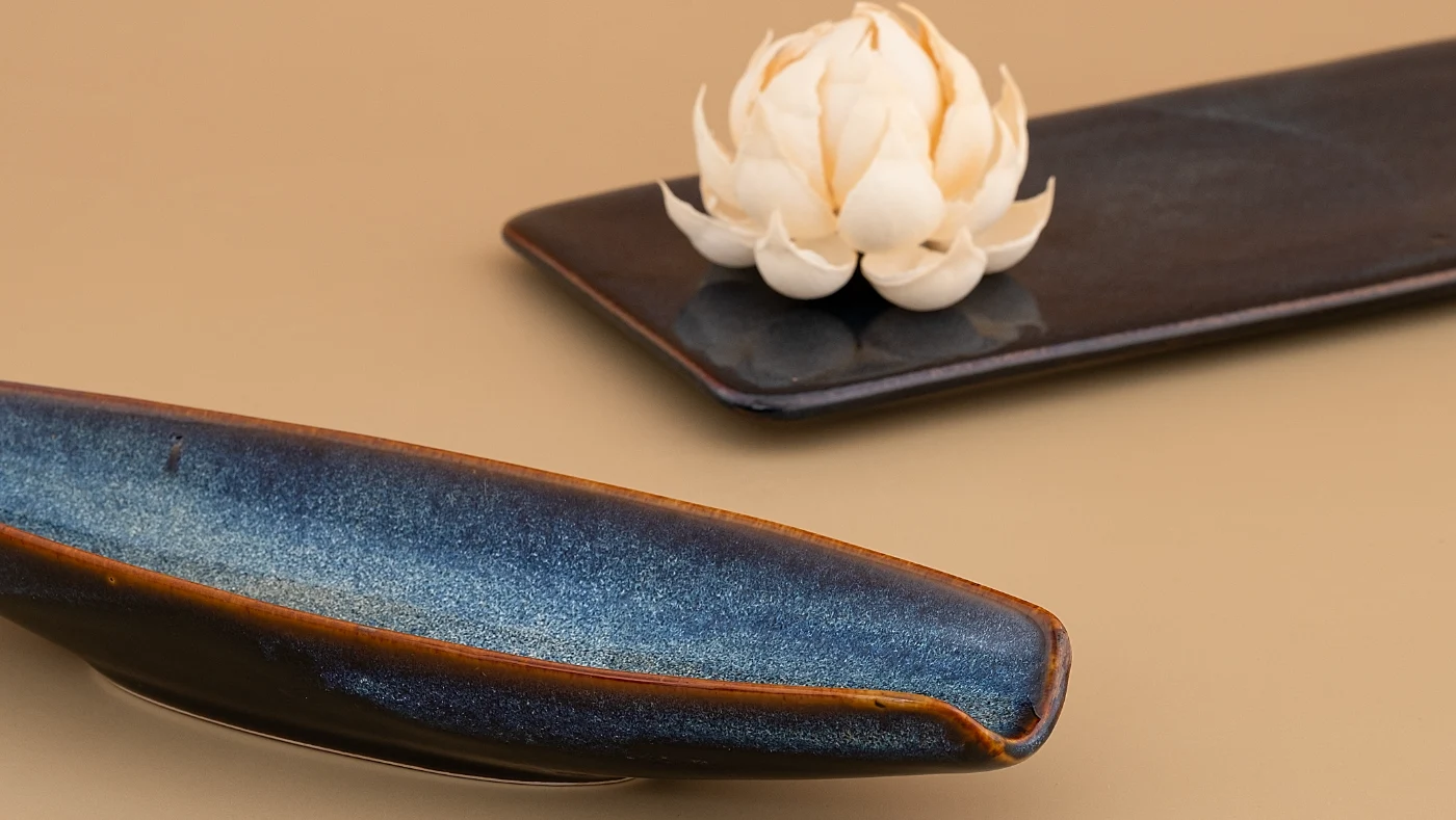 An Indigo Symphony lens tray and rectangular tray in indigo and copper glaze