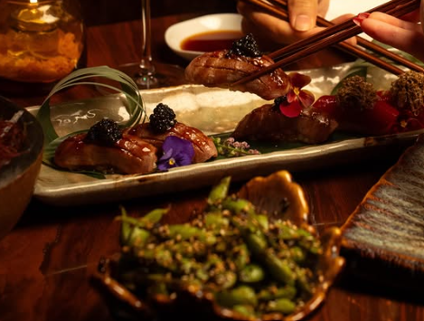 Seared dishes on a long speckled stoneware tray