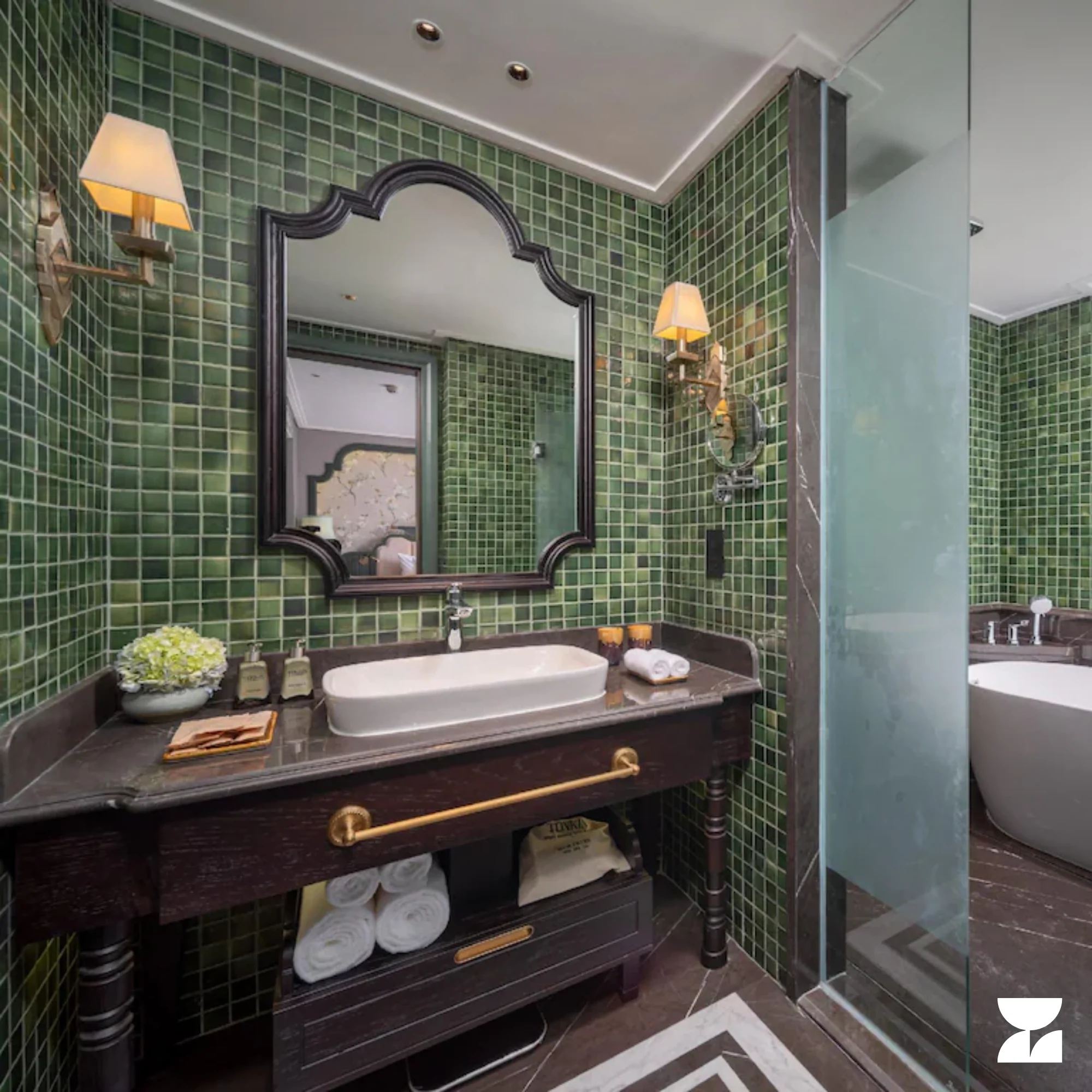 Green ceramic mosaic tiling in a hotel bathroom