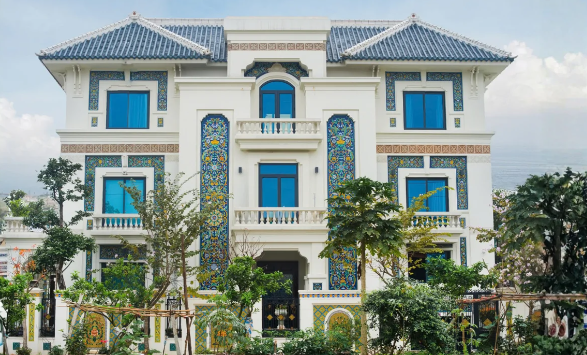 Villa facade with ceramic mosaic panel accents