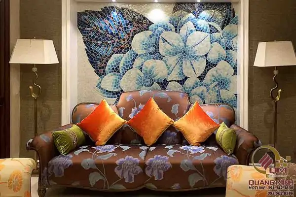 Ceramic mosaic art panel behind a hotel lounge sofa